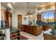 Spacious kitchen with granite countertops and wooden cabinetry at 30014 N Baker Ct, Scottsdale, AZ 85262