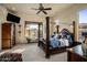 Main bedroom with a large bed, plenty of natural light, and a cozy atmosphere at 30014 N Baker Ct, Scottsdale, AZ 85262