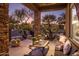 Relaxing covered patio with seating area, perfect for outdoor entertaining at 30014 N Baker Ct, Scottsdale, AZ 85262