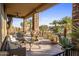 Covered patio with seating and views of the desert landscape at 30014 N Baker Ct, Scottsdale, AZ 85262