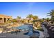 Luxury pool and spa with lounge chairs and desert landscaping at 30014 N Baker Ct, Scottsdale, AZ 85262