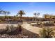 Landscaped pool area with waterfall feature and walkway at 30014 N Baker Ct, Scottsdale, AZ 85262