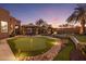 Landscaped backyard putting green with illumination at 30014 N Baker Ct, Scottsdale, AZ 85262