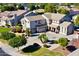 Two-story house with a landscaped yard and driveway, seen from above at 306 E Dennisport Ct, Gilbert, AZ 85295