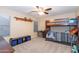 Bedroom with bunk beds and a ceiling fan at 306 E Dennisport Ct, Gilbert, AZ 85295