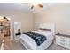 Well-lit bedroom with large closet and ceiling fan at 306 E Dennisport Ct, Gilbert, AZ 85295