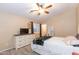 Bright bedroom with dresser and ceiling fan at 306 E Dennisport Ct, Gilbert, AZ 85295