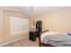 Bright bedroom with built-in desk and window shutters at 306 E Dennisport Ct, Gilbert, AZ 85295