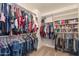 Large walk-in closet with ample shelving and hanging space at 306 E Dennisport Ct, Gilbert, AZ 85295