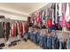 Well-organized walk-in closet with custom shelving at 306 E Dennisport Ct, Gilbert, AZ 85295