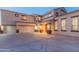 Two-story house with a three-car garage and landscaping at 306 E Dennisport Ct, Gilbert, AZ 85295