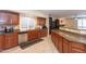 Kitchen with an island, granite countertops, and ample cabinet space at 306 E Dennisport Ct, Gilbert, AZ 85295