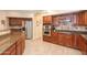 Kitchen with double ovens, gas cooktop, and granite countertops at 306 E Dennisport Ct, Gilbert, AZ 85295