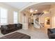 Open living area with high ceilings, staircase and view to kitchen at 306 E Dennisport Ct, Gilbert, AZ 85295