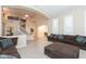 Living area with high ceilings, open floor plan, and curved staircase at 306 E Dennisport Ct, Gilbert, AZ 85295