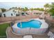 Aerial view of kidney-shaped pool with fenced area at 306 E Dennisport Ct, Gilbert, AZ 85295