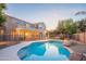 Stunning pool and backyard with house in background at 306 E Dennisport Ct, Gilbert, AZ 85295