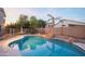 Inviting kidney-shaped pool with waterfall feature at 306 E Dennisport Ct, Gilbert, AZ 85295