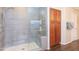 Walk-in shower with glass enclosure and built-in seat at 306 E Dennisport Ct, Gilbert, AZ 85295