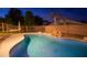 Night view of a refreshing kidney-shaped pool at 306 E Dennisport Ct, Gilbert, AZ 85295