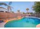 Relaxing kidney-shaped pool with waterfall feature at 306 E Dennisport Ct, Gilbert, AZ 85295