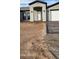 Front view of a house with a white door and gray exterior at 31540 W Maricopa St, Buckeye, AZ 85326