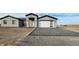 New construction home with gray exterior, white garage door, and paved driveway at 31540 W Maricopa St, Buckeye, AZ 85326