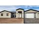 New stucco home with a two-car garage and paved driveway at 31540 W Maricopa St, Buckeye, AZ 85326