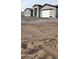 House exterior showcasing a gray and black color scheme and a large driveway at 31540 W Maricopa St, Buckeye, AZ 85326