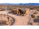 Aerial view of a single-story house with desert landscaping and mountain views at 31617 N 168Th St, Rio Verde, AZ 85263