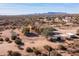 Aerial view of a desert home with mountain views at 31617 N 168Th St, Rio Verde, AZ 85263