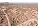 Aerial view of a desert property with a house and surrounding land at 31617 N 168Th St, Rio Verde, AZ 85263