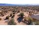 Aerial view of a desert property with a house and surrounding landscape at 31617 N 168Th St, Rio Verde, AZ 85263