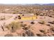 Aerial view of home on a hilltop with desert landscape at 31617 N 168Th St, Rio Verde, AZ 85263