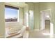 Bathroom with a large tub, glass shower, and views at 31617 N 168Th St, Rio Verde, AZ 85263