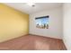 Bedroom with yellow accent wall and wood flooring at 31617 N 168Th St, Rio Verde, AZ 85263