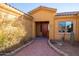 House entry with a red door and brick walkway at 31617 N 168Th St, Rio Verde, AZ 85263