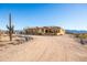 Driveway leading to a beautiful tan ranch house at 31617 N 168Th St, Rio Verde, AZ 85263