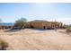 Stucco home with tile roof, attached garage, and gated entry at 31617 N 168Th St, Rio Verde, AZ 85263