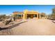 Backyard view of a tan home with a covered patio at 31617 N 168Th St, Rio Verde, AZ 85263