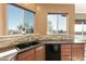 Kitchen sink with granite countertops and stone backsplash at 31617 N 168Th St, Rio Verde, AZ 85263