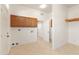 Laundry room with wood cabinets and tiled floor at 31617 N 168Th St, Rio Verde, AZ 85263