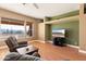 Living room with hardwood floors, two armchairs, and built-in shelving at 31617 N 168Th St, Rio Verde, AZ 85263