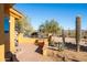 Desert landscape with a brick patio, built-in seating, and cacti at 31617 N 168Th St, Rio Verde, AZ 85263