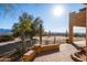 A sunny patio with desert plants and distant mountain views at 31617 N 168Th St, Rio Verde, AZ 85263