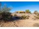 View of a tan ranch house from the backyard at 31617 N 168Th St, Rio Verde, AZ 85263