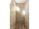 Bright shower with stone floor and tile surround at 31617 N 168Th St, Rio Verde, AZ 85263