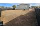 Large, unlandscaped backyard with a dirt and gravel surface at 318 S Ellsworth Rd, Mesa, AZ 85208