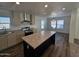 Bright kitchen with an island and stainless steel appliances at 318 S Ellsworth Rd, Mesa, AZ 85208