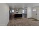 Modern kitchen with island, stainless steel appliances, and light cabinets at 318 S Ellsworth Rd, Mesa, AZ 85208